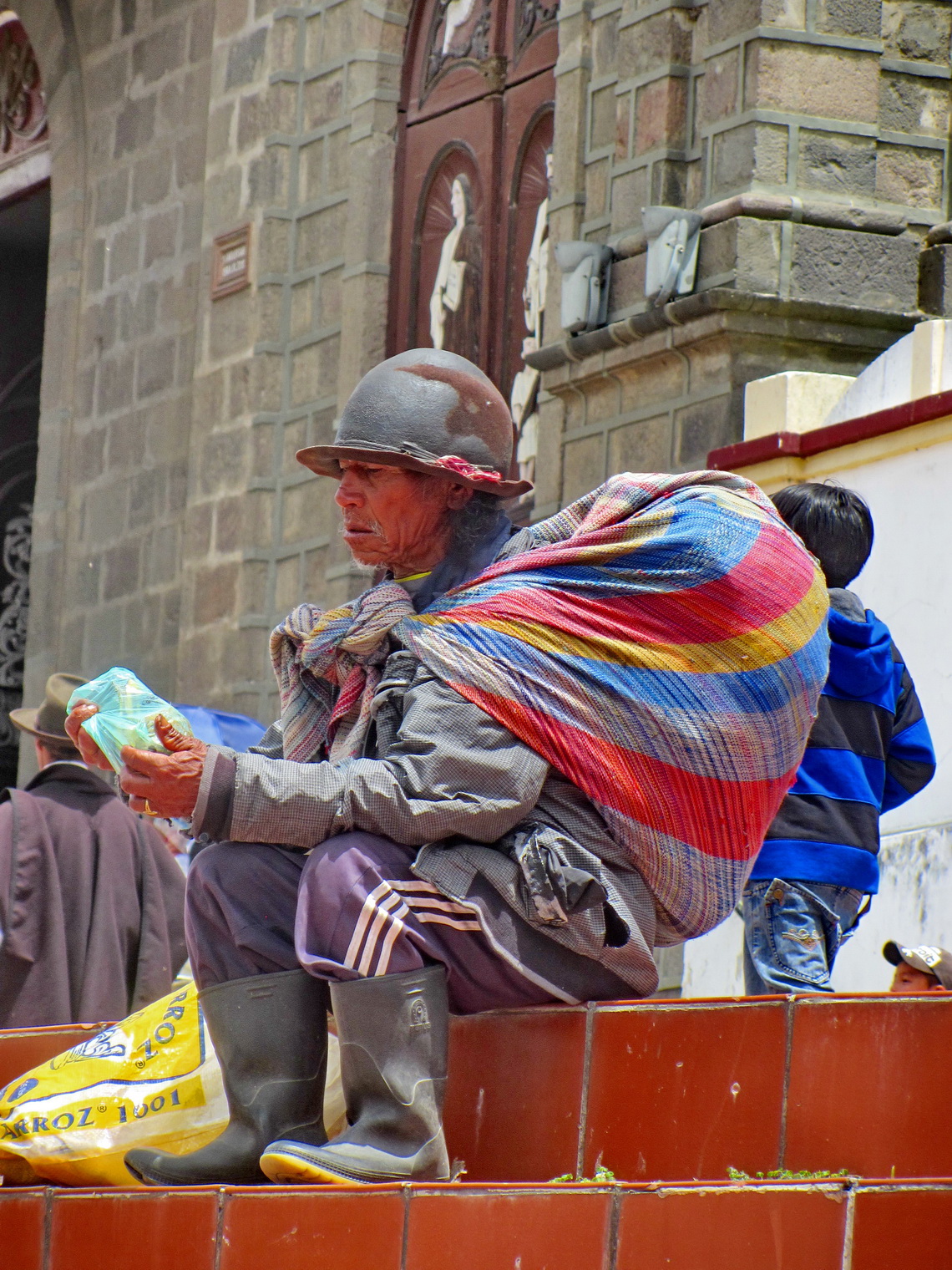 Man in front of the main church of Cotacachi