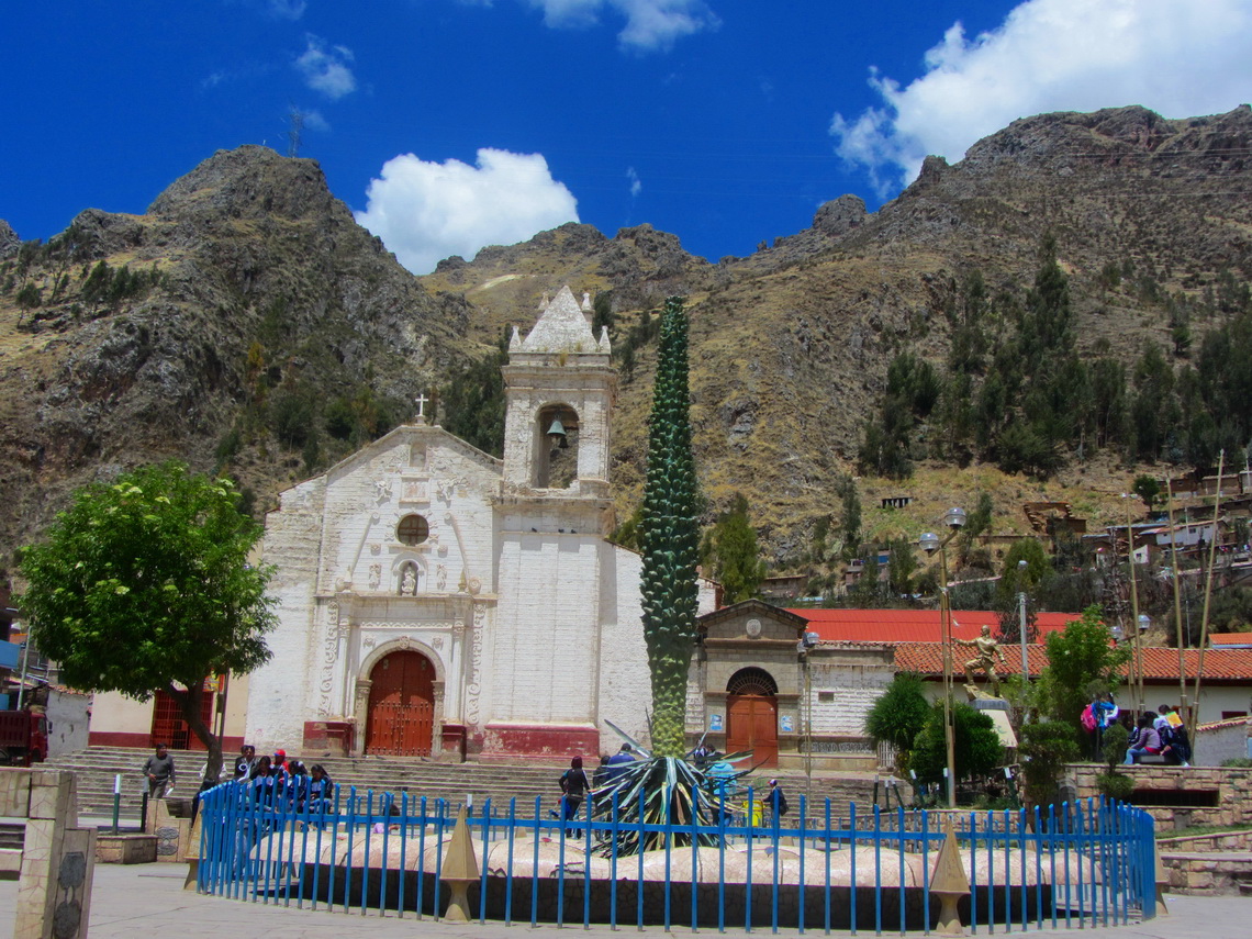 Artificial flower Puya Raimondi and church Iglesia de San Francisco in Huancavelica