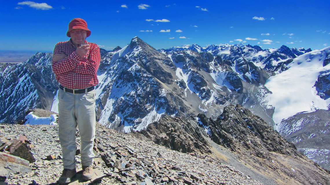 Tommy on the summit of Cerro Austria with the northern part of Cordillera Real in the background