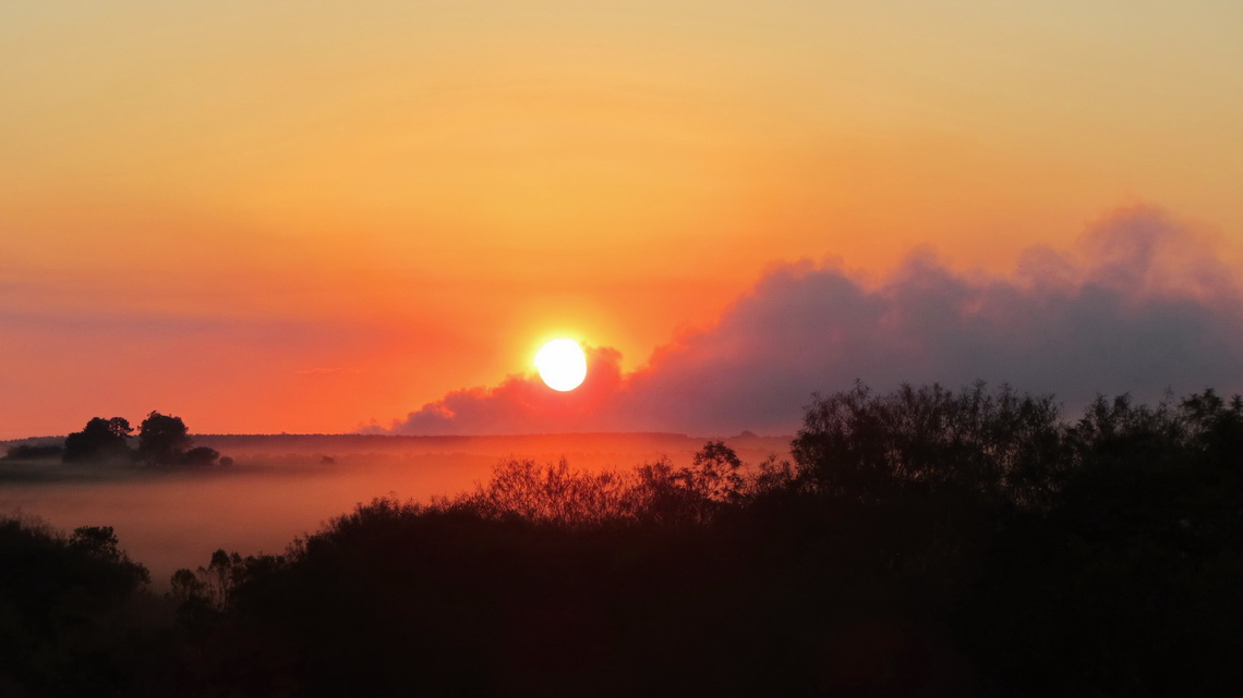 Sunset on the way to Carlos Pellegrini with some smoke from burning fields