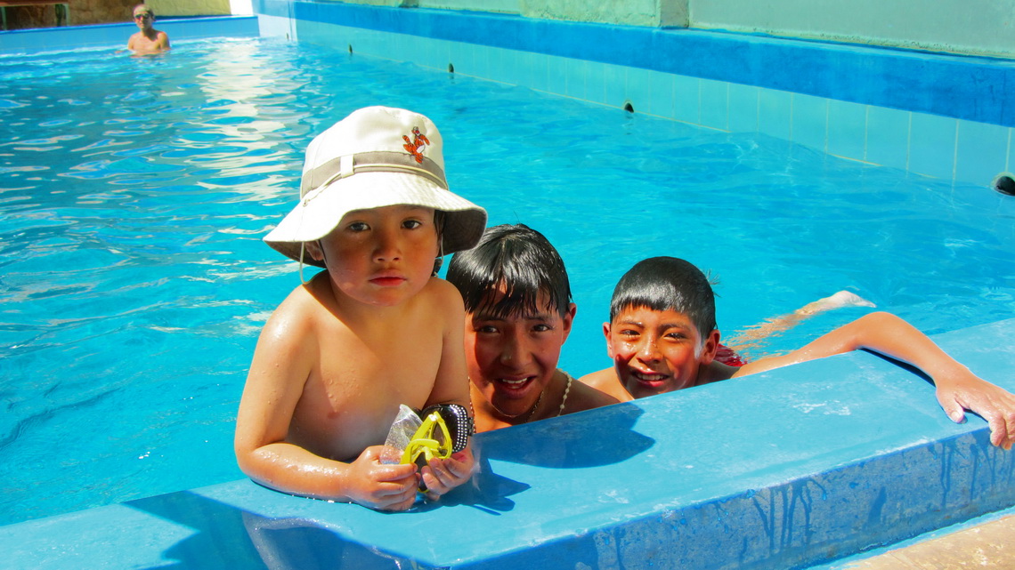 Kids in the hot springs of Lucho