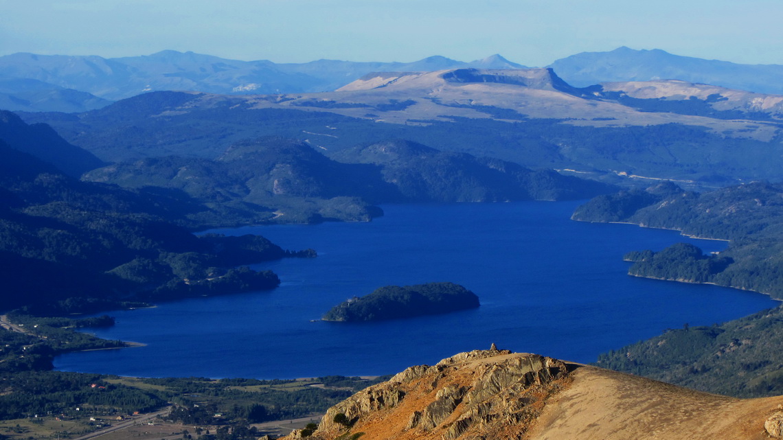 Blue Lago Moquehue and brown Volcan Batea Mahuida in the back of the lake